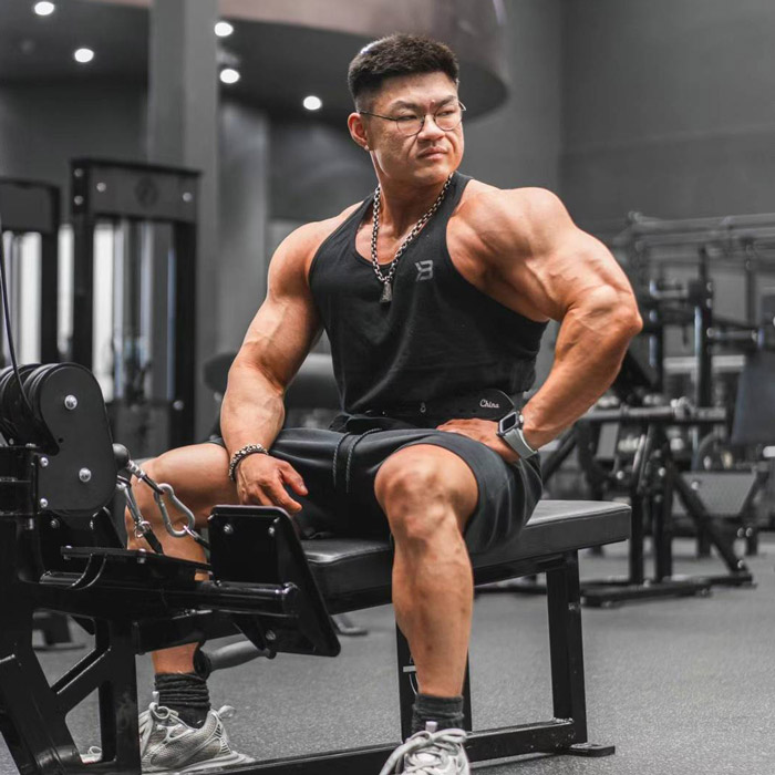 Kevin Chen seated in a gym